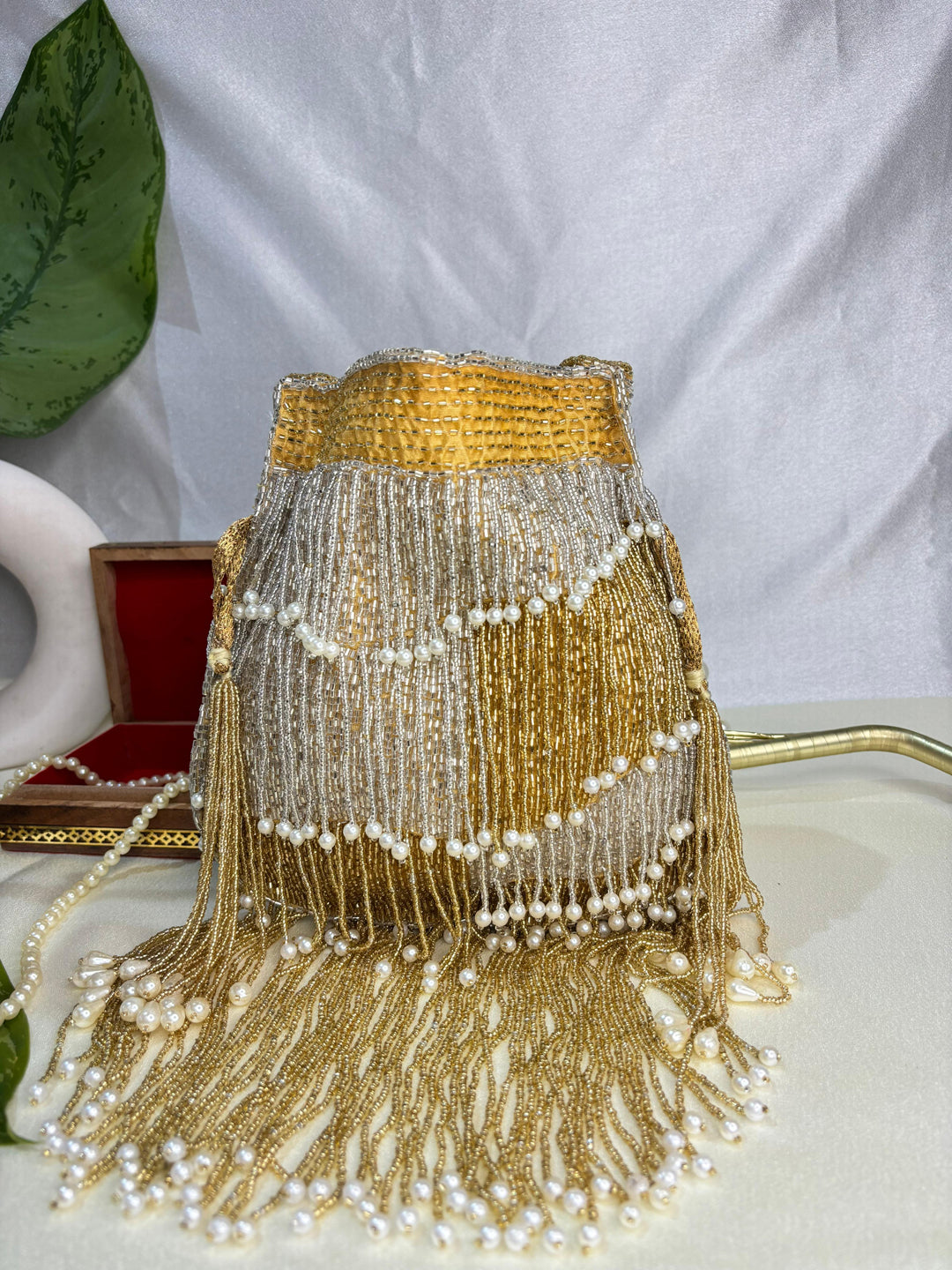 Naomi gold and silver multi layer pearl latkan potli