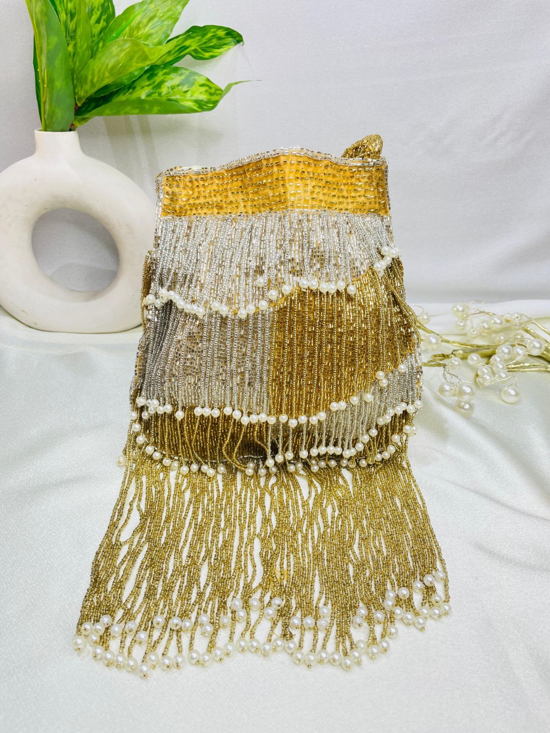 Naomi gold and silver multi layer pearl latkan potli