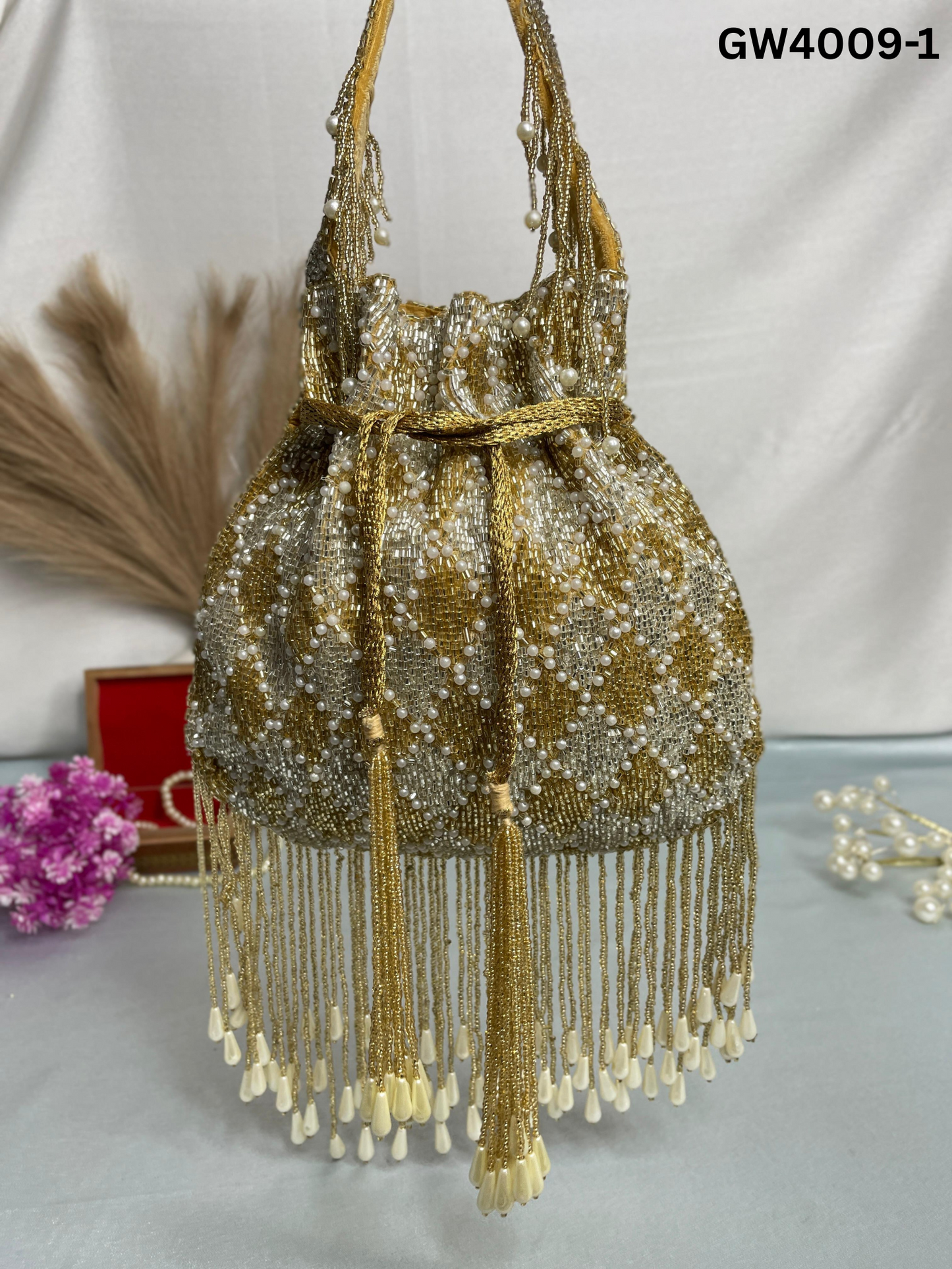 Elena gold and silver handwork potli