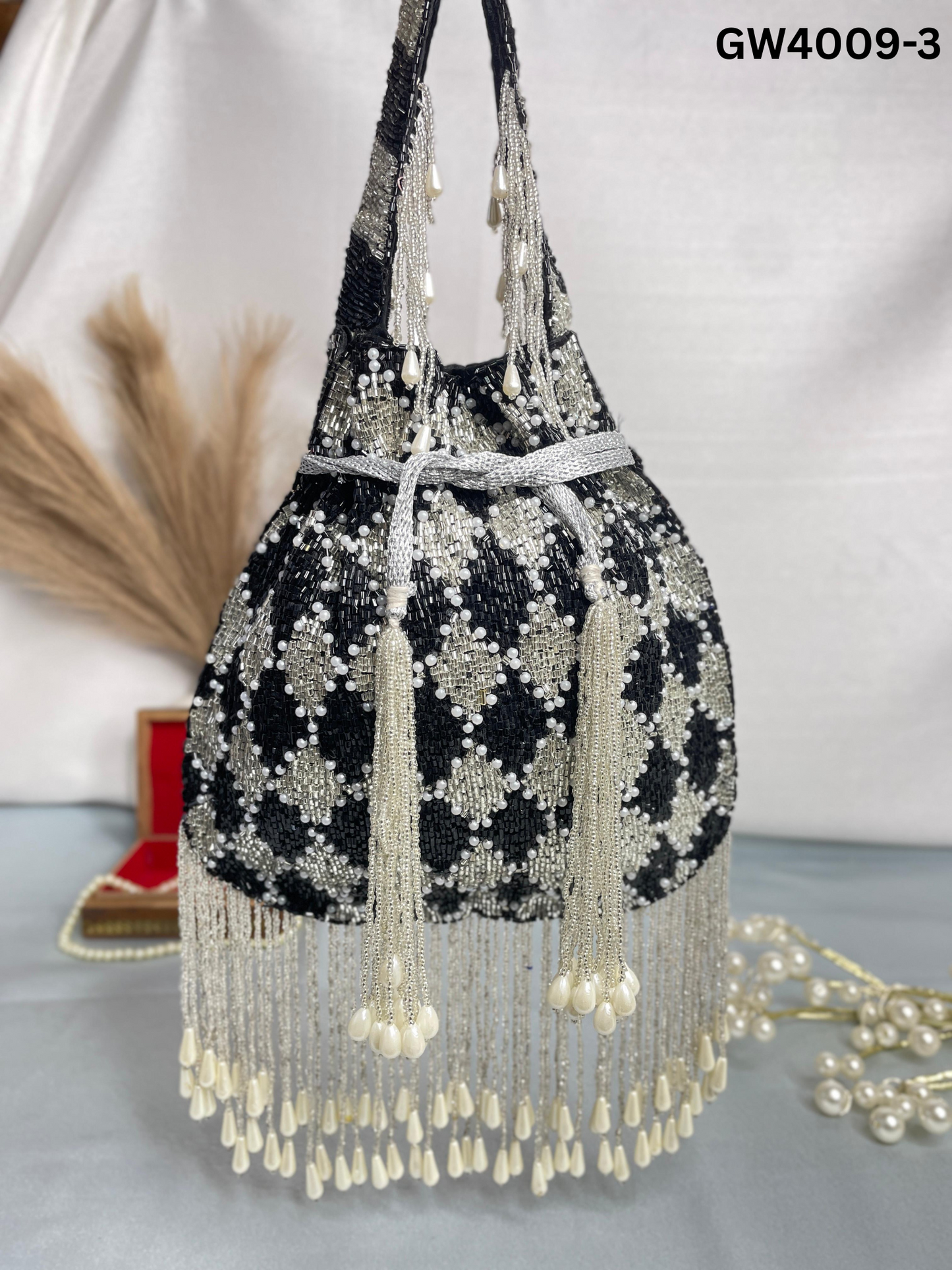 Elena gold and silver handwork potli