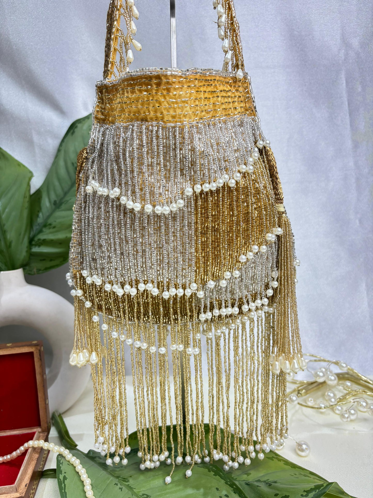 Naomi gold and silver multi layer pearl latkan potli