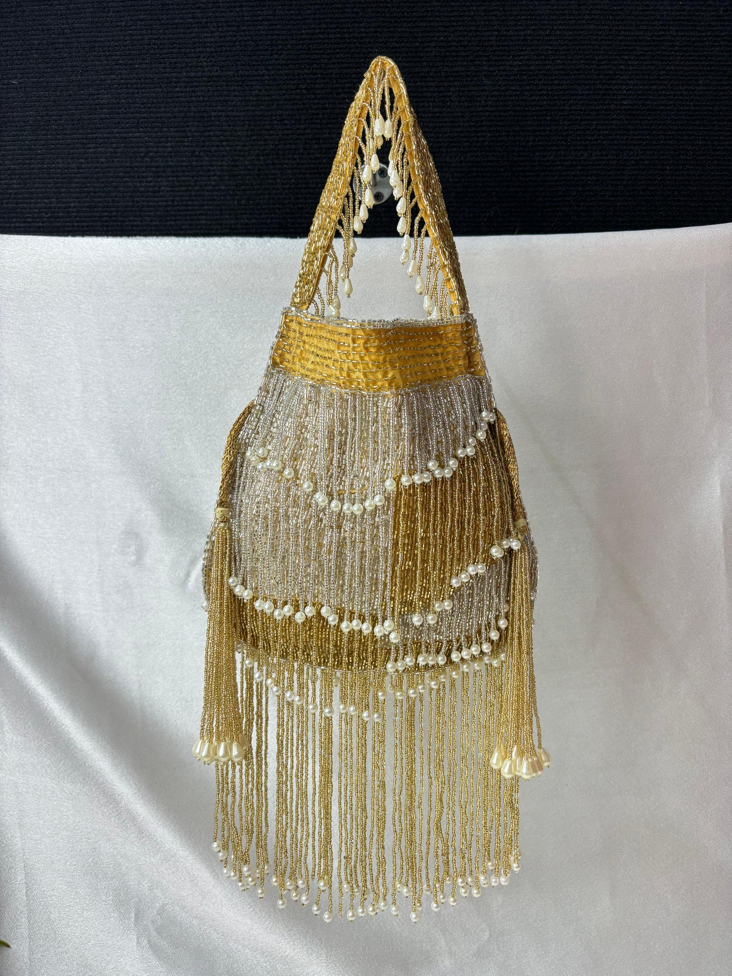 Naomi gold and silver multi layer pearl latkan potli