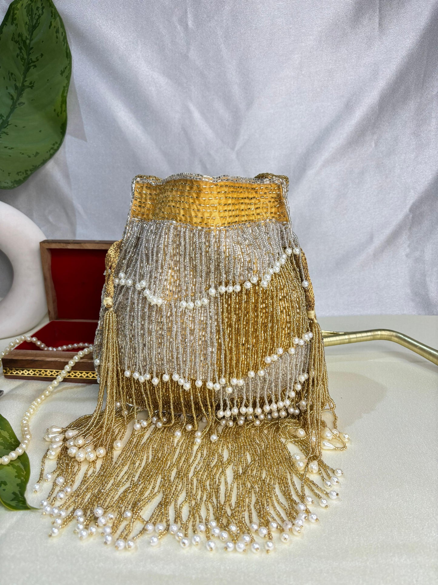 Naomi gold and silver multi layer pearl latkan potli