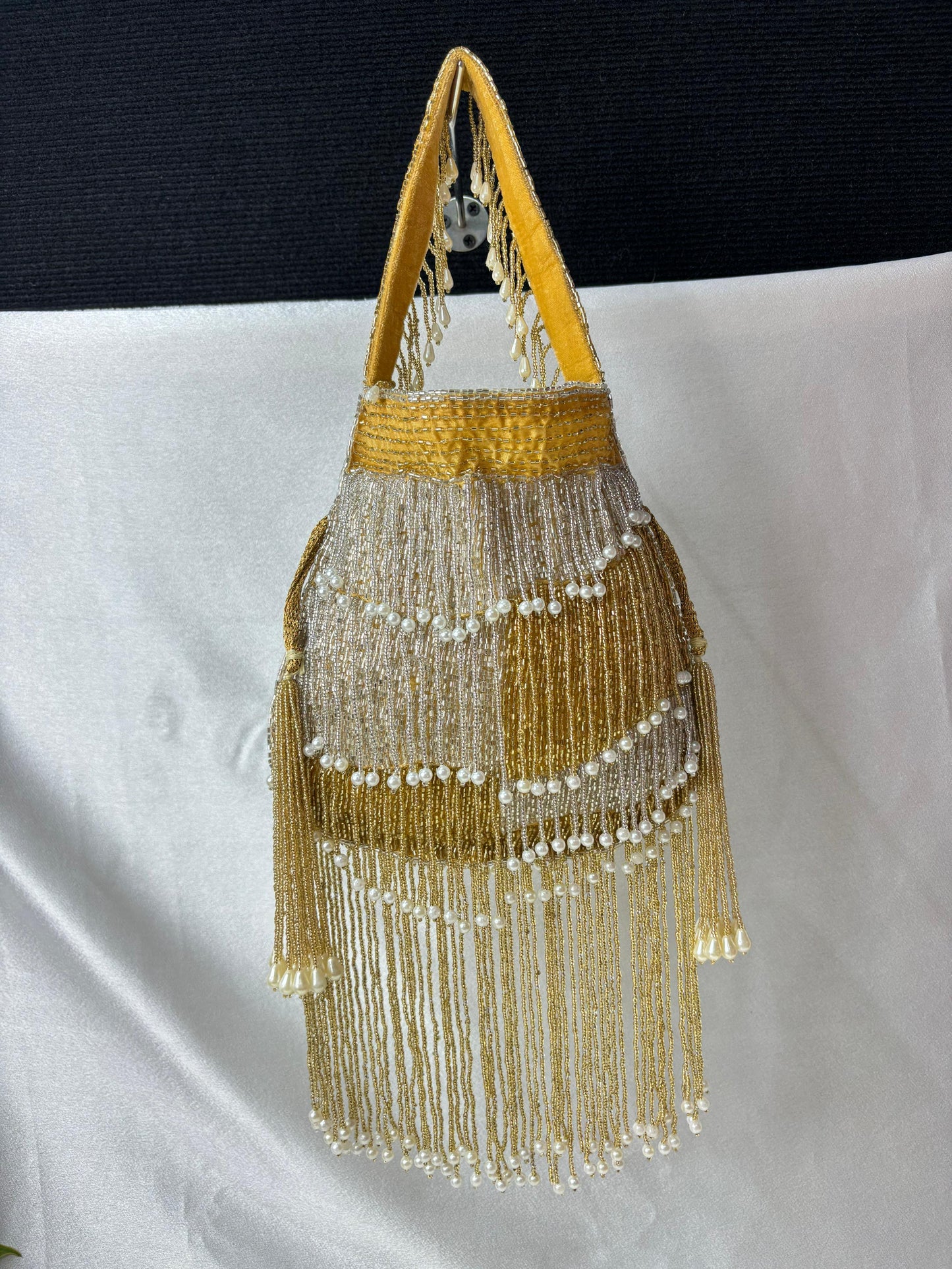 Naomi gold and silver multi layer pearl latkan potli