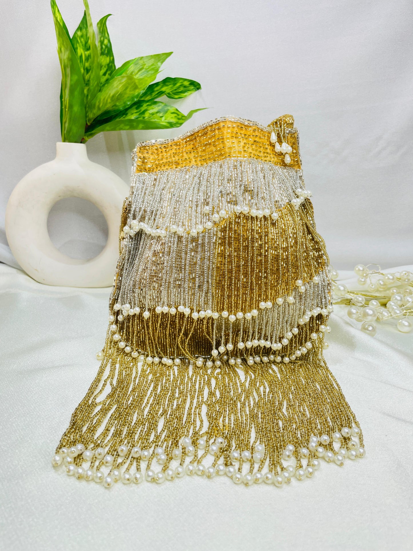 Naomi gold and silver multi layer pearl latkan potli