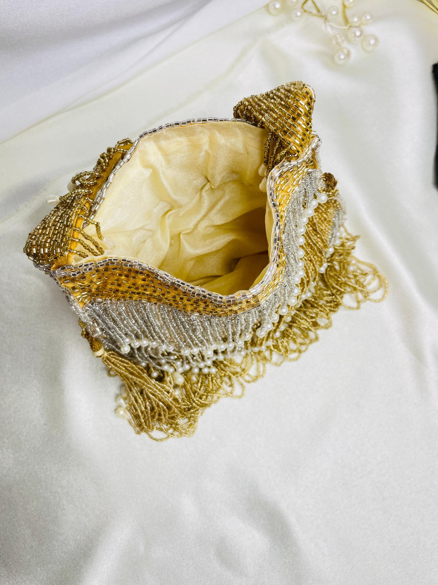 Naomi gold and silver multi layer pearl latkan potli