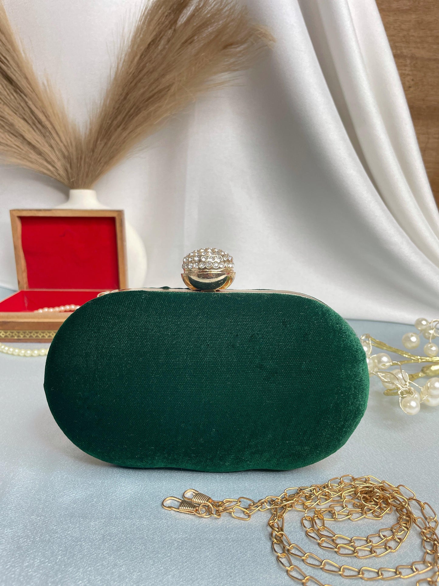 Hand embroidered capsule clutch