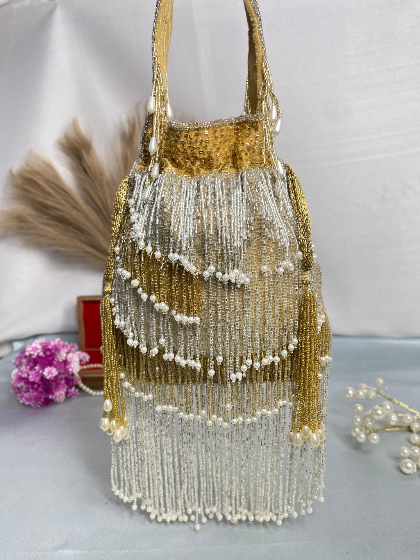 Naomi gold and silver multi layer pearl latkan potli