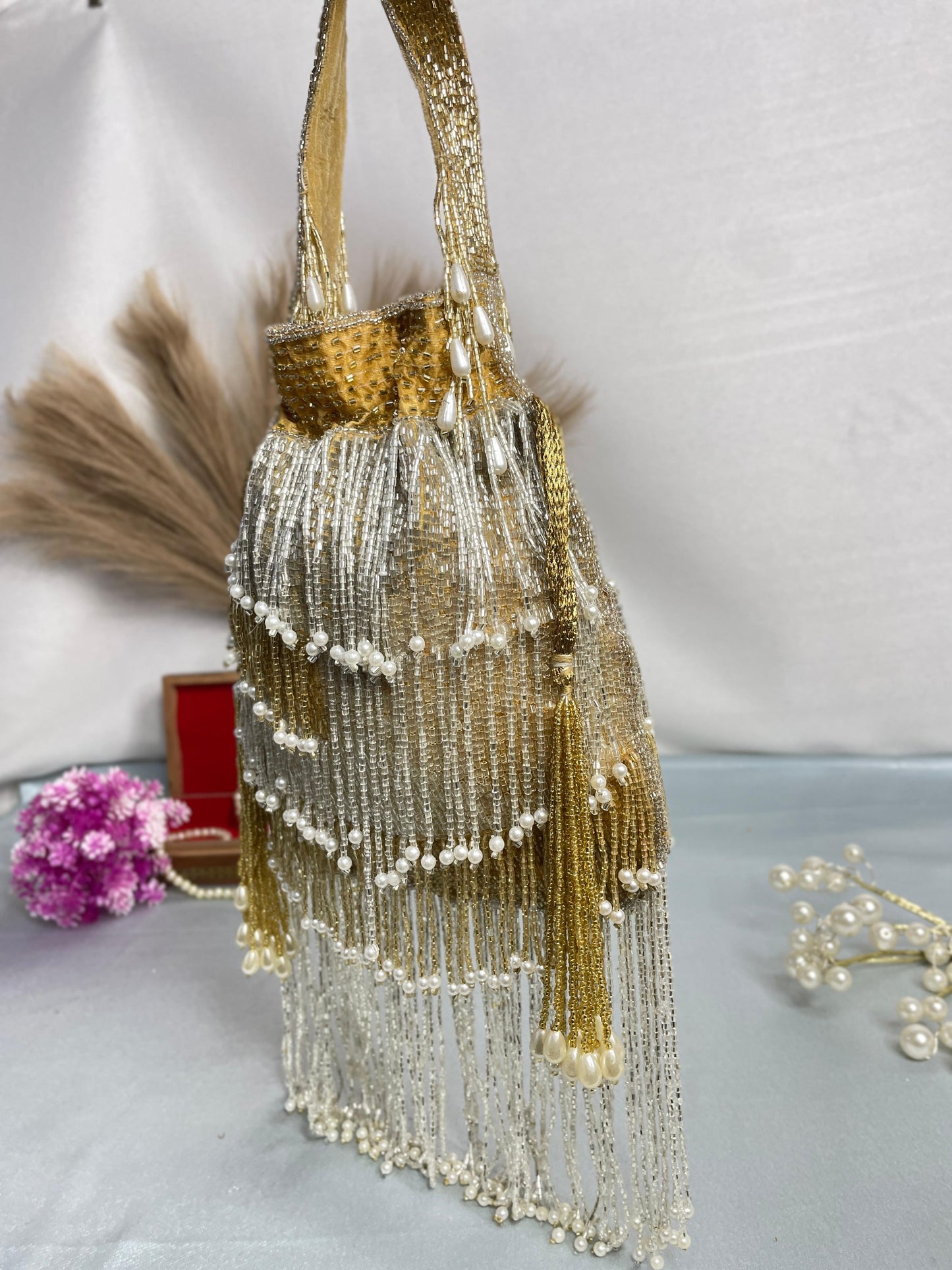 Naomi gold and silver multi layer pearl latkan potli