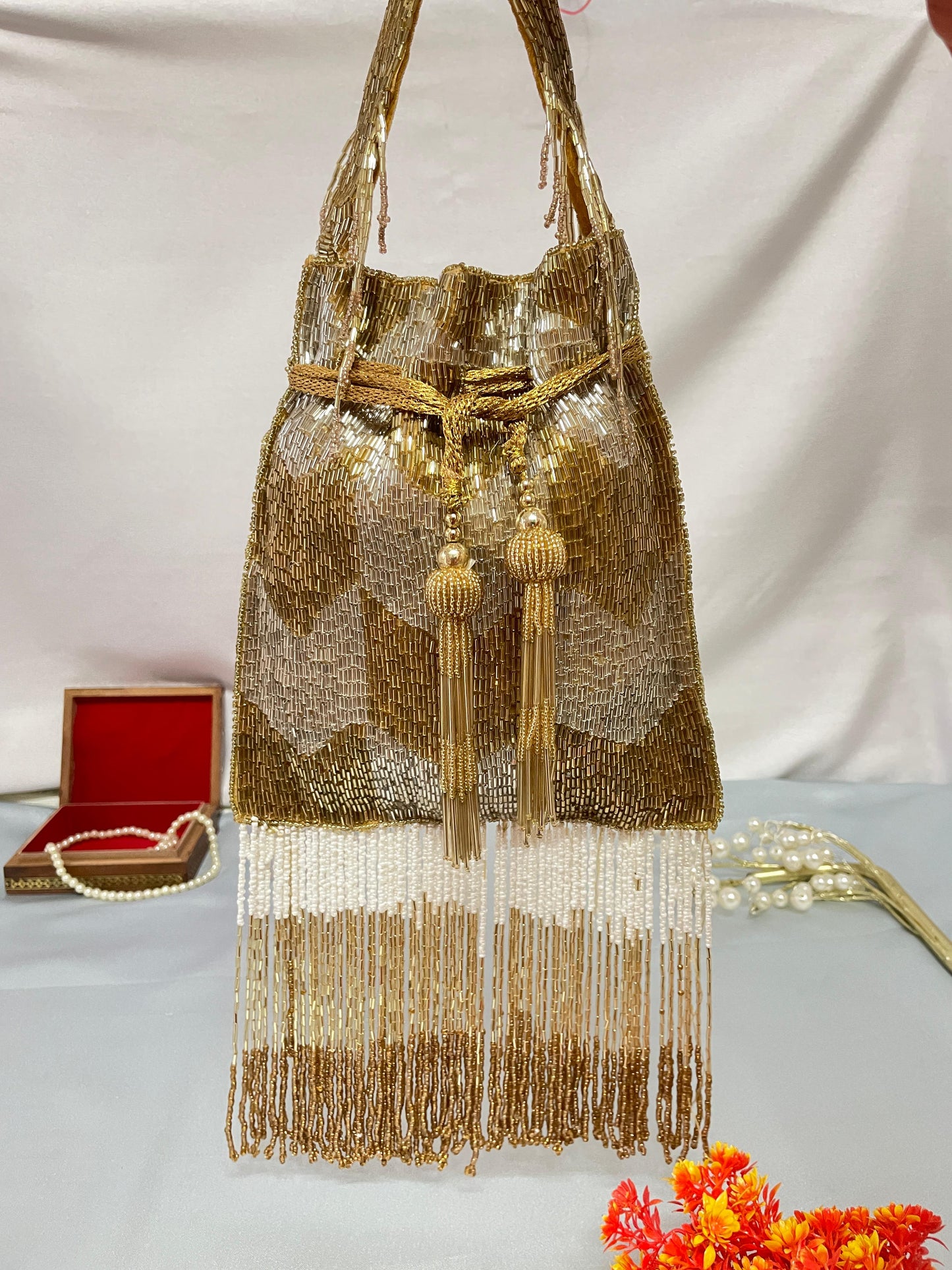 Ellie gold silver nalki work potli