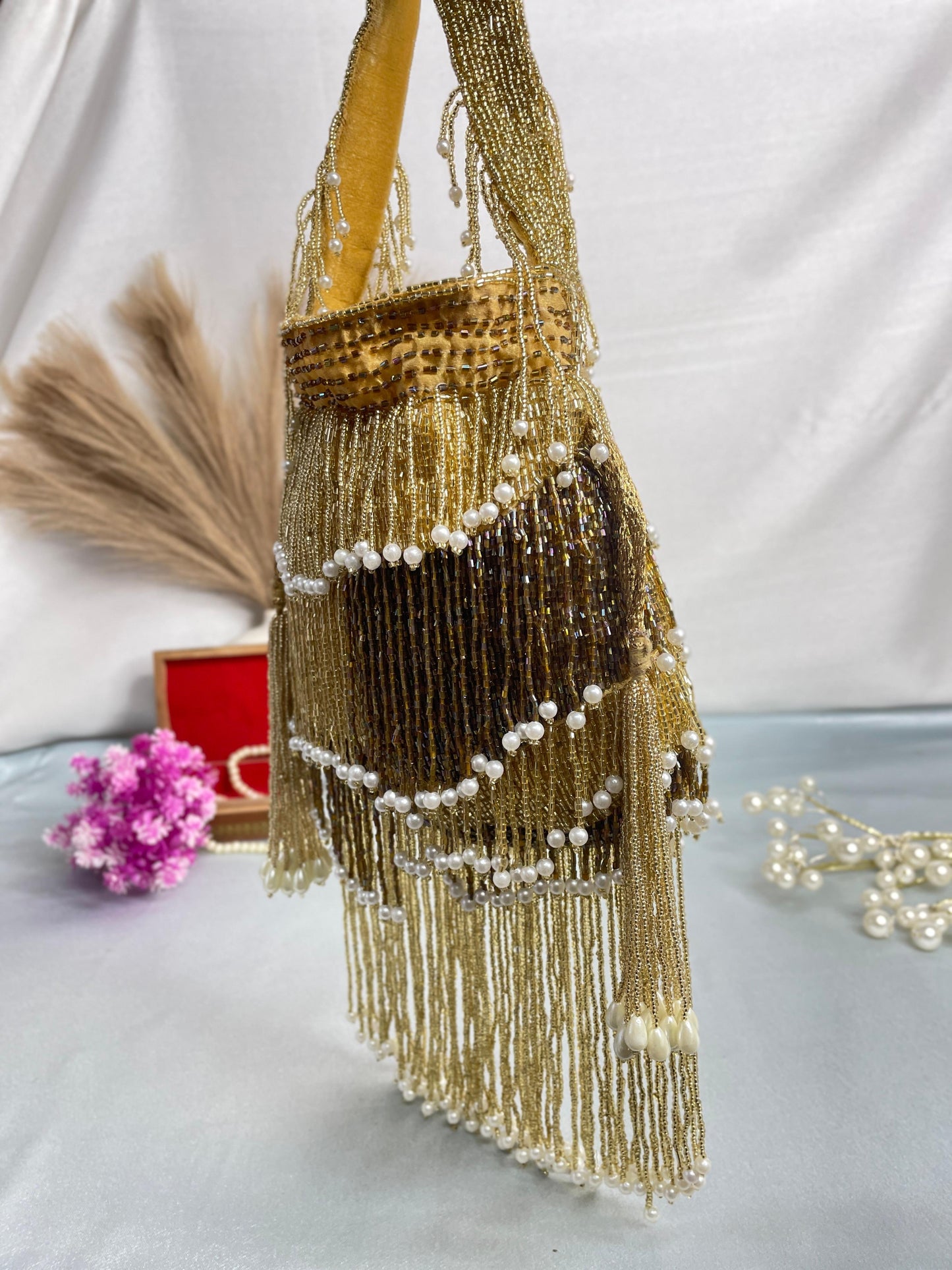 Naomi gold and silver multi layer pearl latkan potli