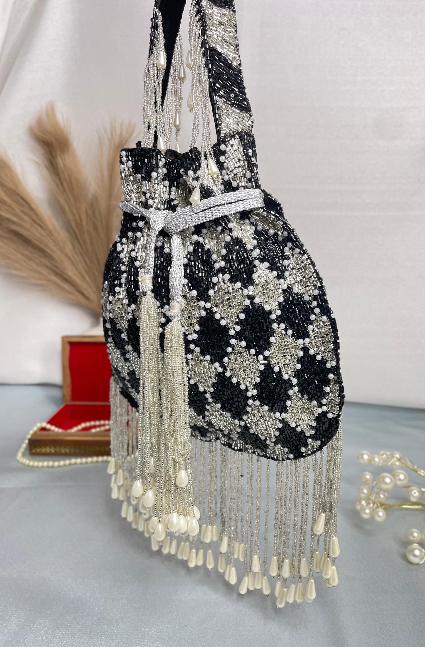 Elena gold and silver handwork potli