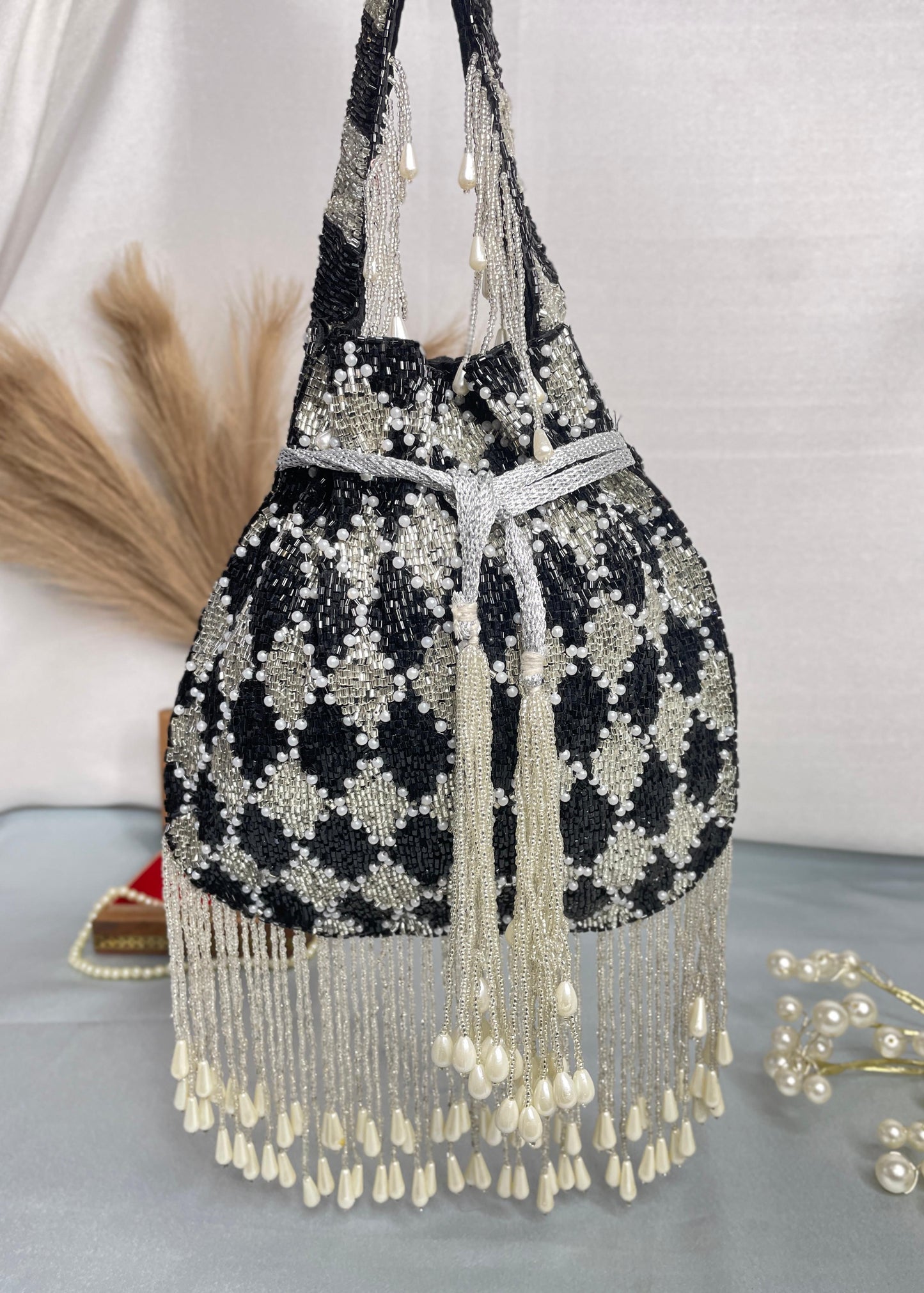 Elena gold and silver handwork potli