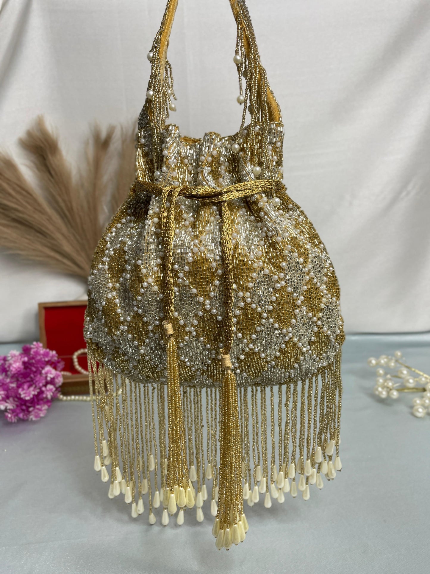 Elena gold and silver handwork potli