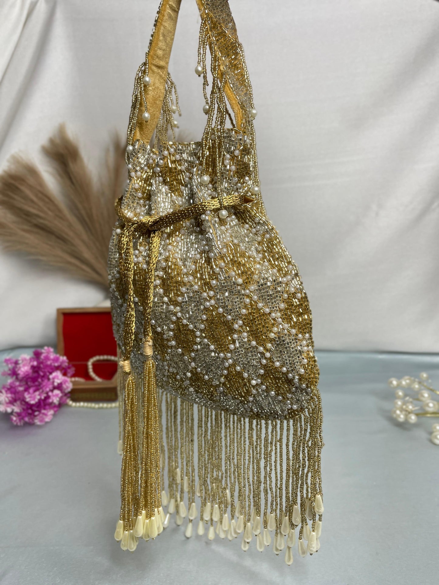 Elena gold and silver handwork potli