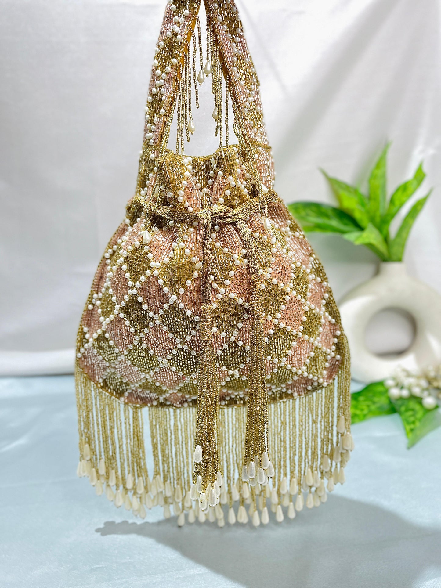 Elena gold and silver handwork potli