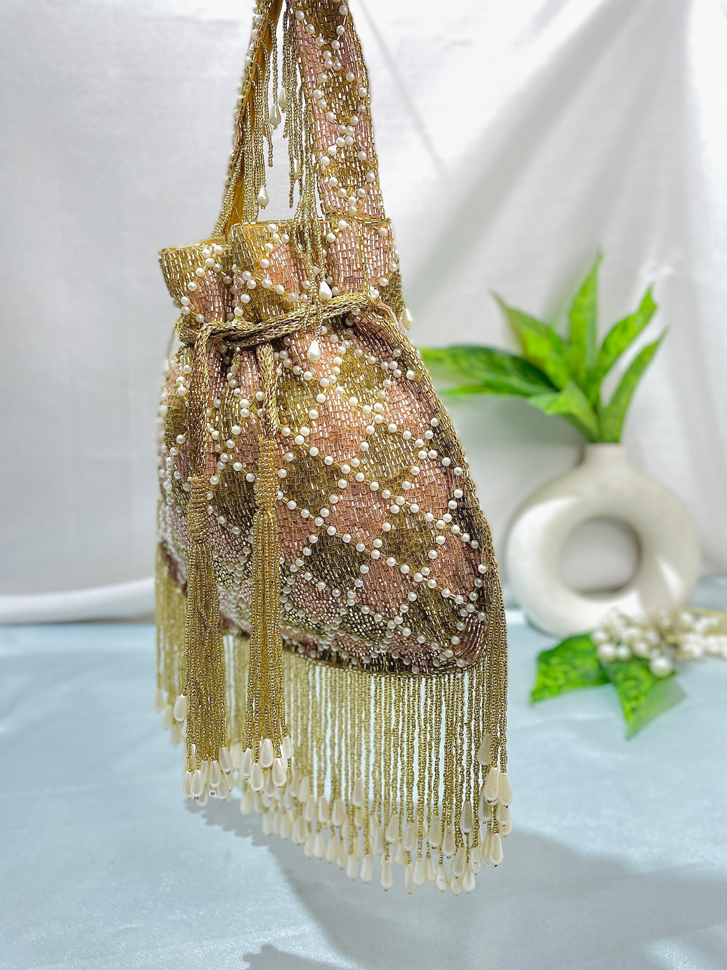 Elena gold and silver handwork potli