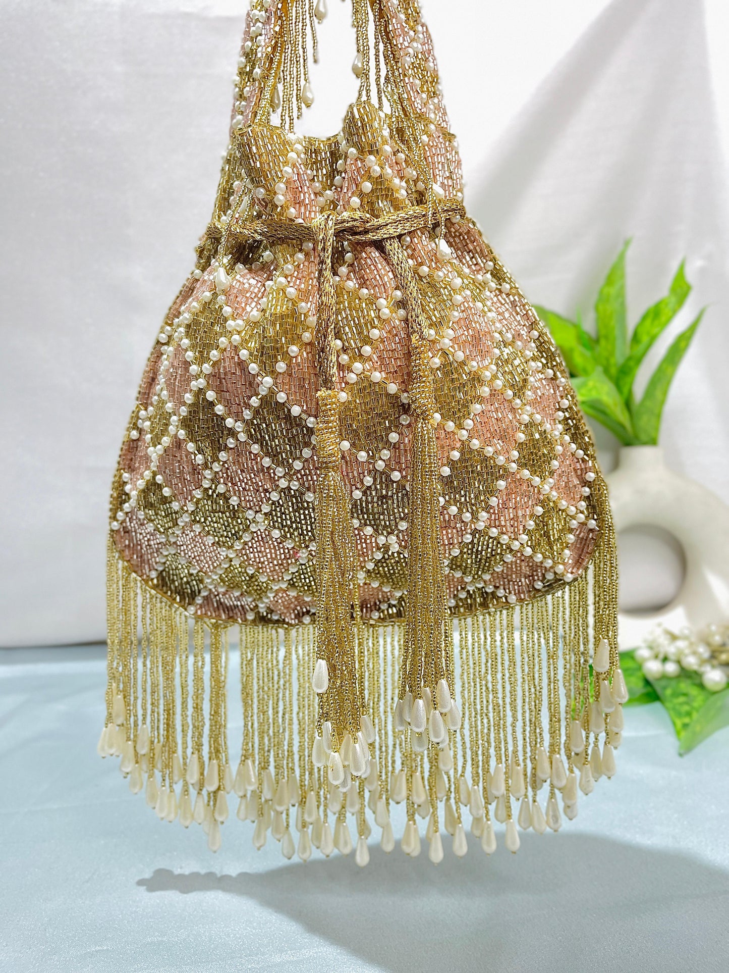 Elena gold and silver handwork potli