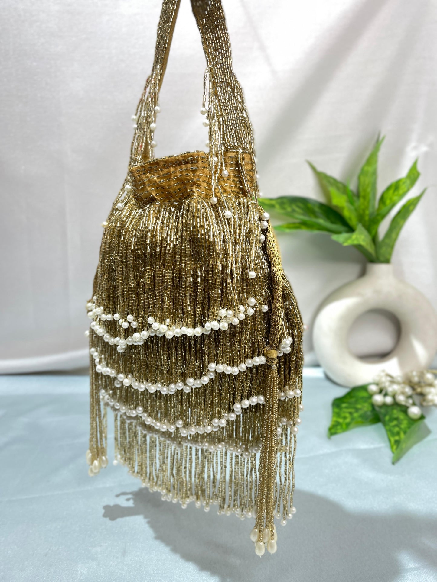 Naomi gold multi layer pearl latkan potli