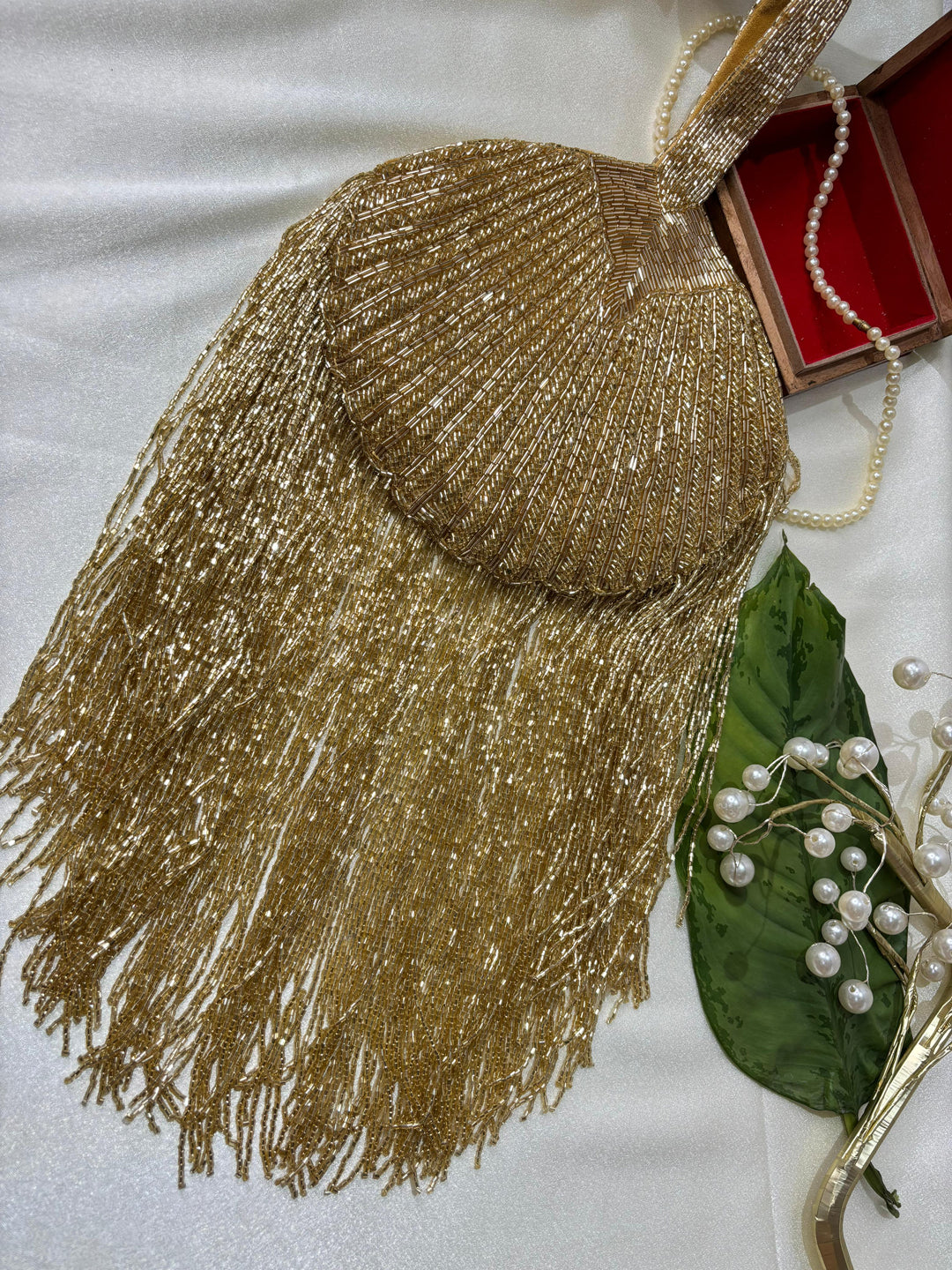 Gold Beaded Fringe Clutch with playful tassels and hidden button closure