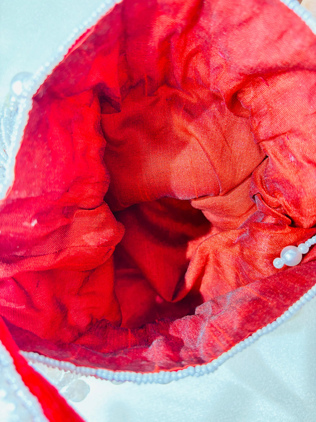 Handcrafted Nalki Work Potli Bag – Elegant Floral Design