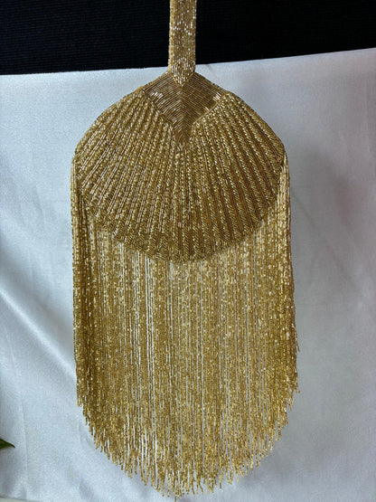 Gold Beaded Fringe Clutch with playful tassels and hidden button closure