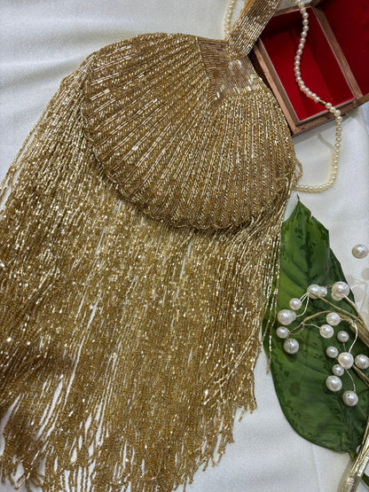 Gold Beaded Fringe Clutch with playful tassels and hidden button closure
