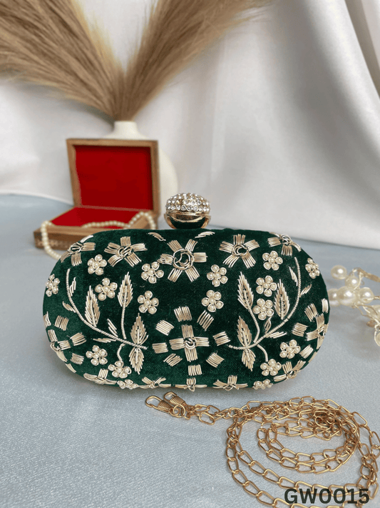 Hand embroidered capsule clutch