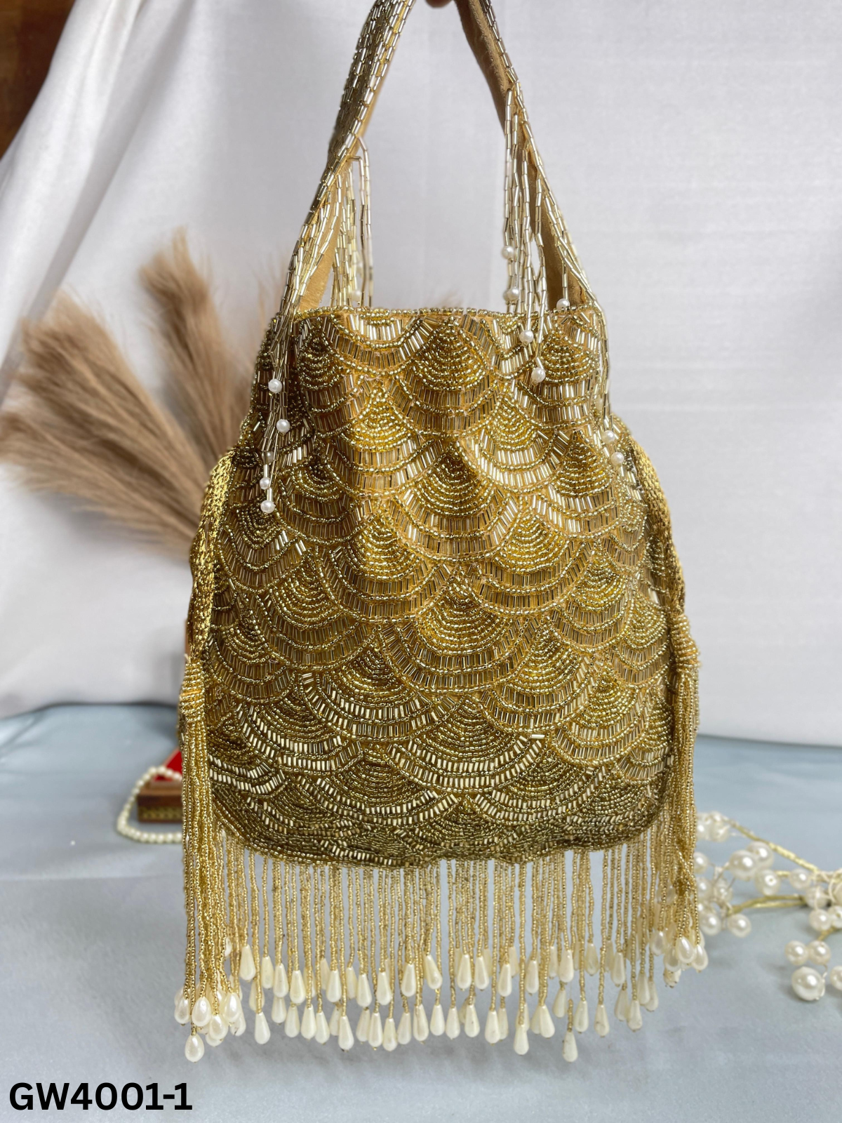 Olivia golden nalki work potli gold