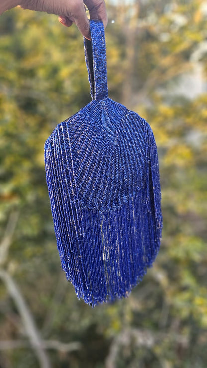 Gold Beaded Fringe Clutch with playful tassels and hidden button closure