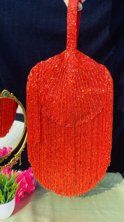 Gold Beaded Fringe Clutch with playful tassels and hidden button closure