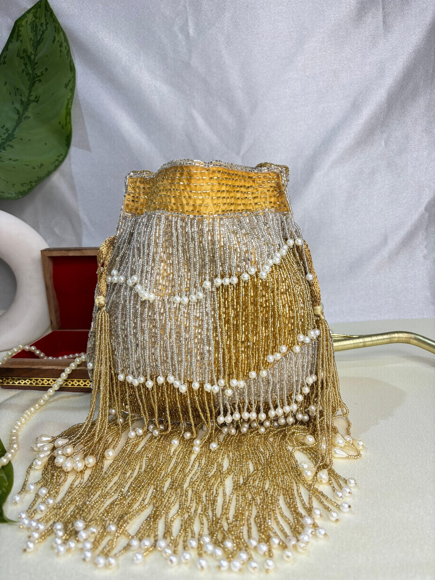 Naomi gold and silver multi layer pearl latkan potli