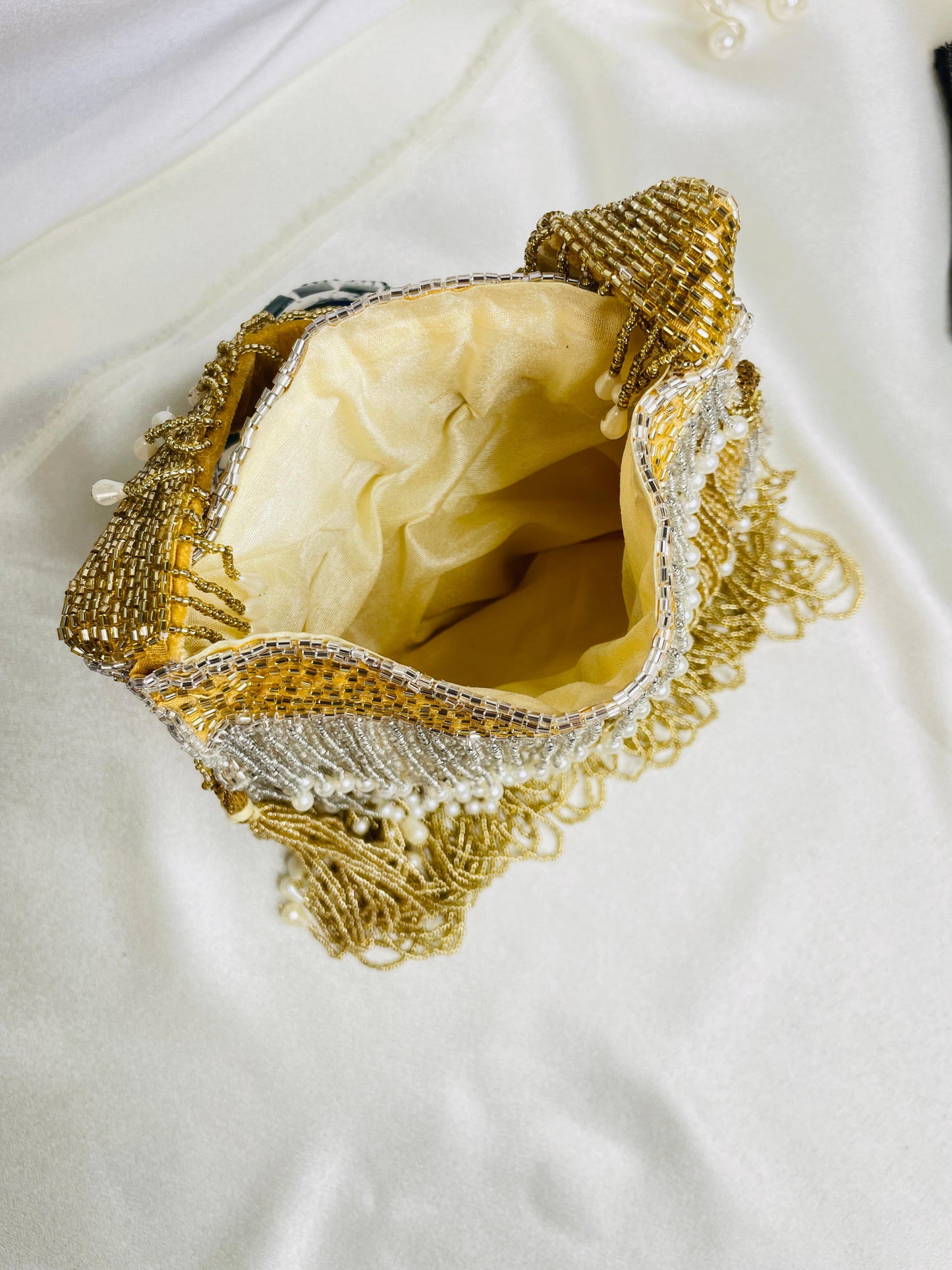 Naomi gold and silver multi layer pearl latkan potli