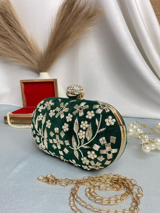 Hand embroidered capsule clutch
